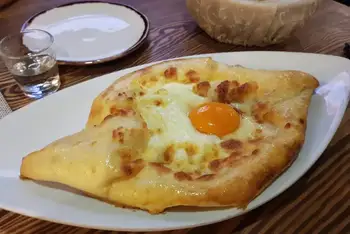 Serve instantly. Swirl the yolk and butter through the molten cheese at the table and tear, dunk, repeat.