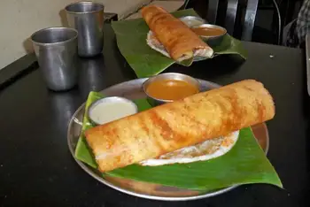 Spoon potato filling down the center, fold the dosa over, and serve at once with the chutney. Repeat, wiping the pan between dosas.