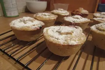 Dust with powdered sugar and serve warm, with brandy butter or a little cream if you like. Leftovers keep 3 days in a tin and refresh in a low oven.