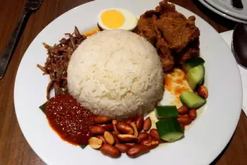 Serve at once, with extra sambal on the table.