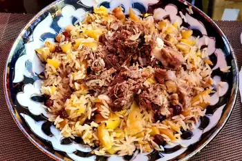Rest 10 minutes off the heat. Lift out the garlic, then fold the rice up from the bottom so meat and carrots marble through it. Serve heaped on a plat