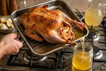 Roast for 1 hour, then ladle or pour off all the fat that has collected in the pan into a heatproof jar. Return the goose to the oven and keep roastin